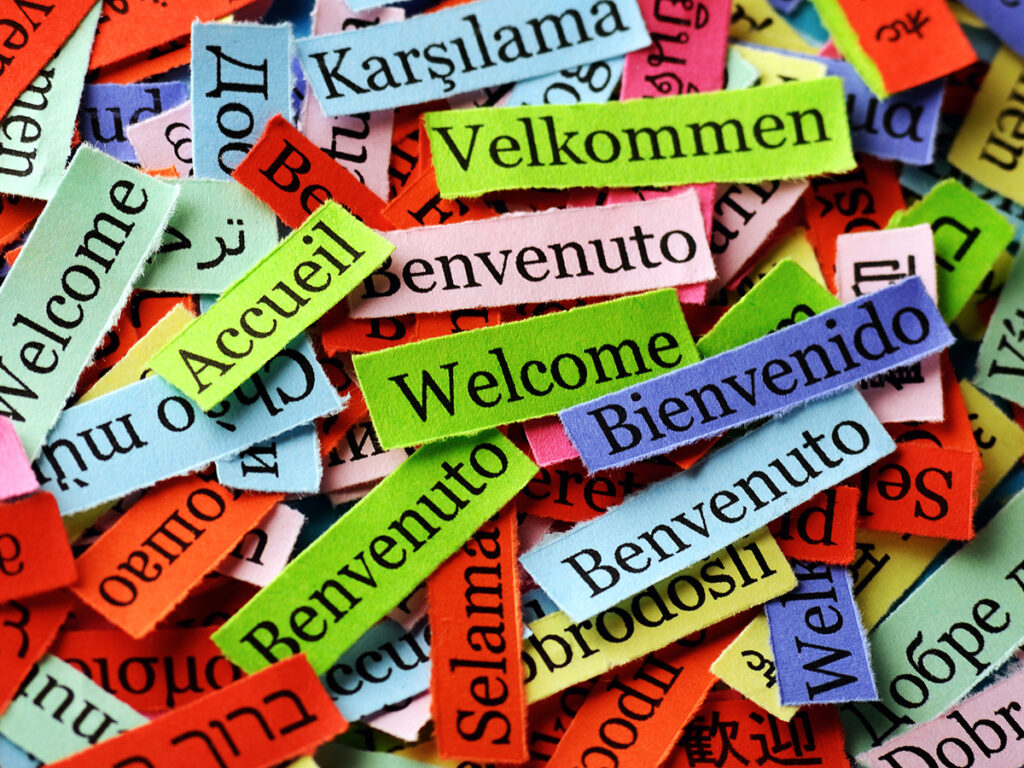 welcome  Word Cloud  printed on  paper on blue font