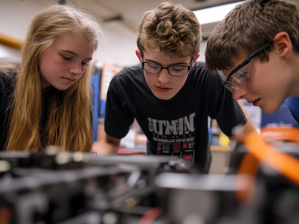 A high school robotics team working on their project, promoting STEM education and teamwork hyper realistic --ar 16:9 --v 6.1 Job ID: 5efe0cf7-7930-4193-bf9d-391451877f00