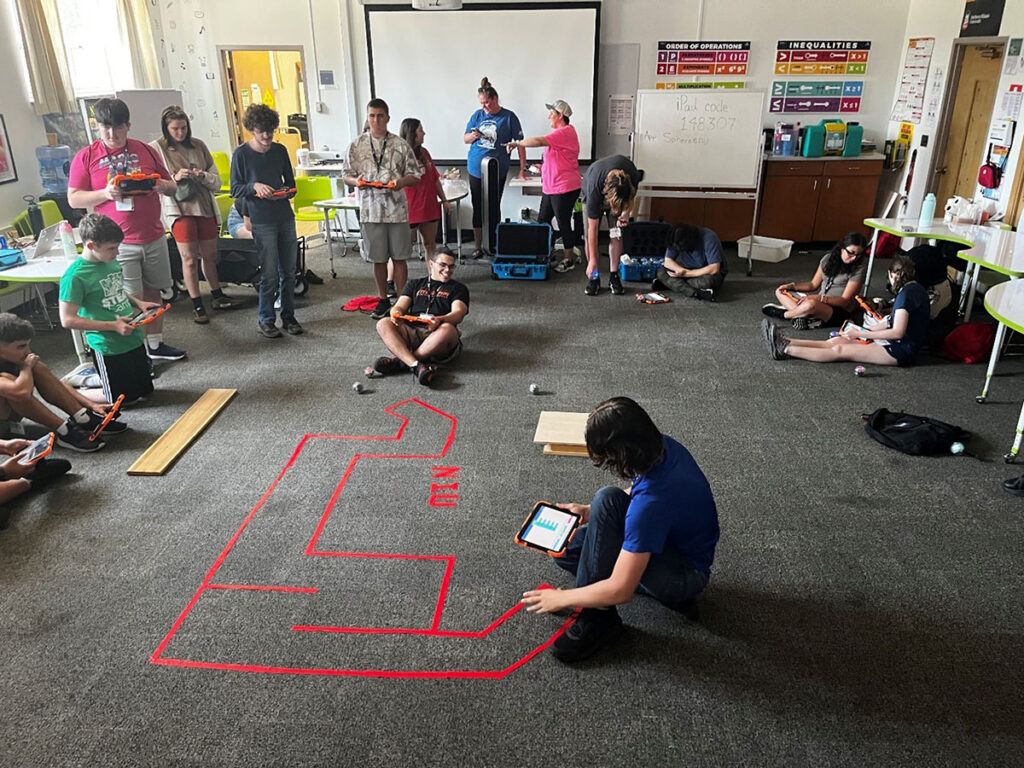 an obstacle course set up for robotics on the floor of our NIU STEAM classroom