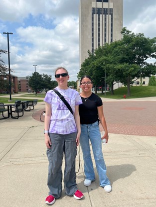 A student and mentor on the campus of NIU