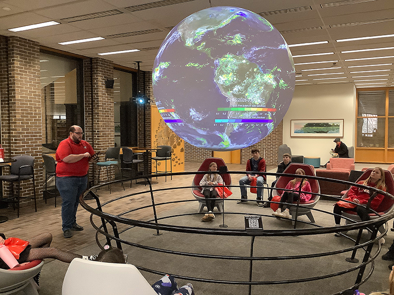 NIU Founders Library with an Earth globe