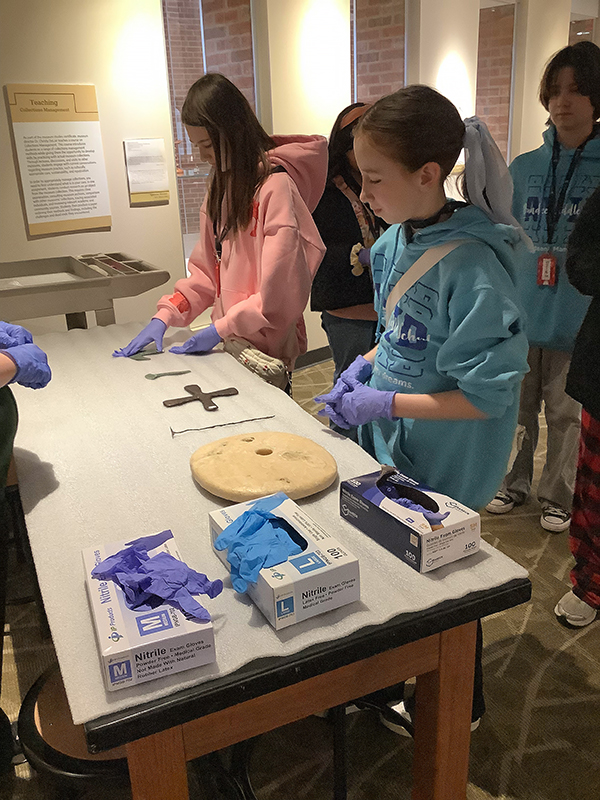 Students working with artifacts in the NIU Pick Museum